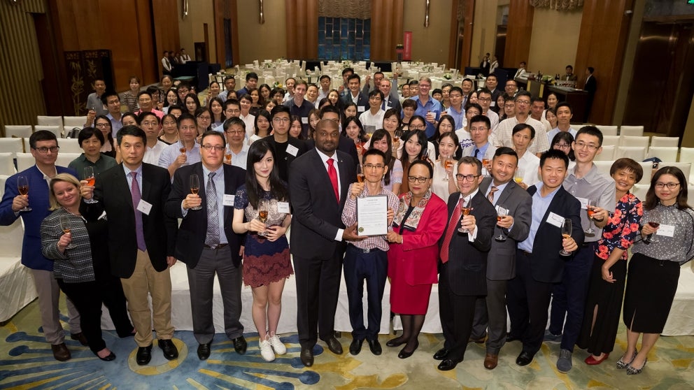 President Jackson poses with members of the RAA Shanghai Alumni Chapter