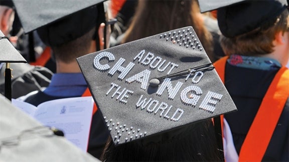Mortar board with "About to Change the World"