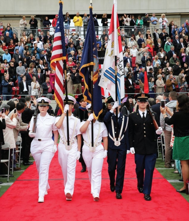 Military color guard marching at Rensselaer graduation