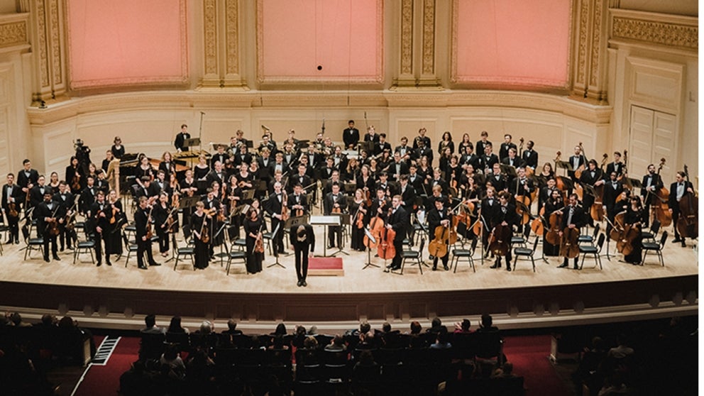 Rensselaer orchestra on stage performing at Carnegie Hall