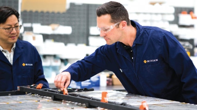 Assembly workers in Rivian factory